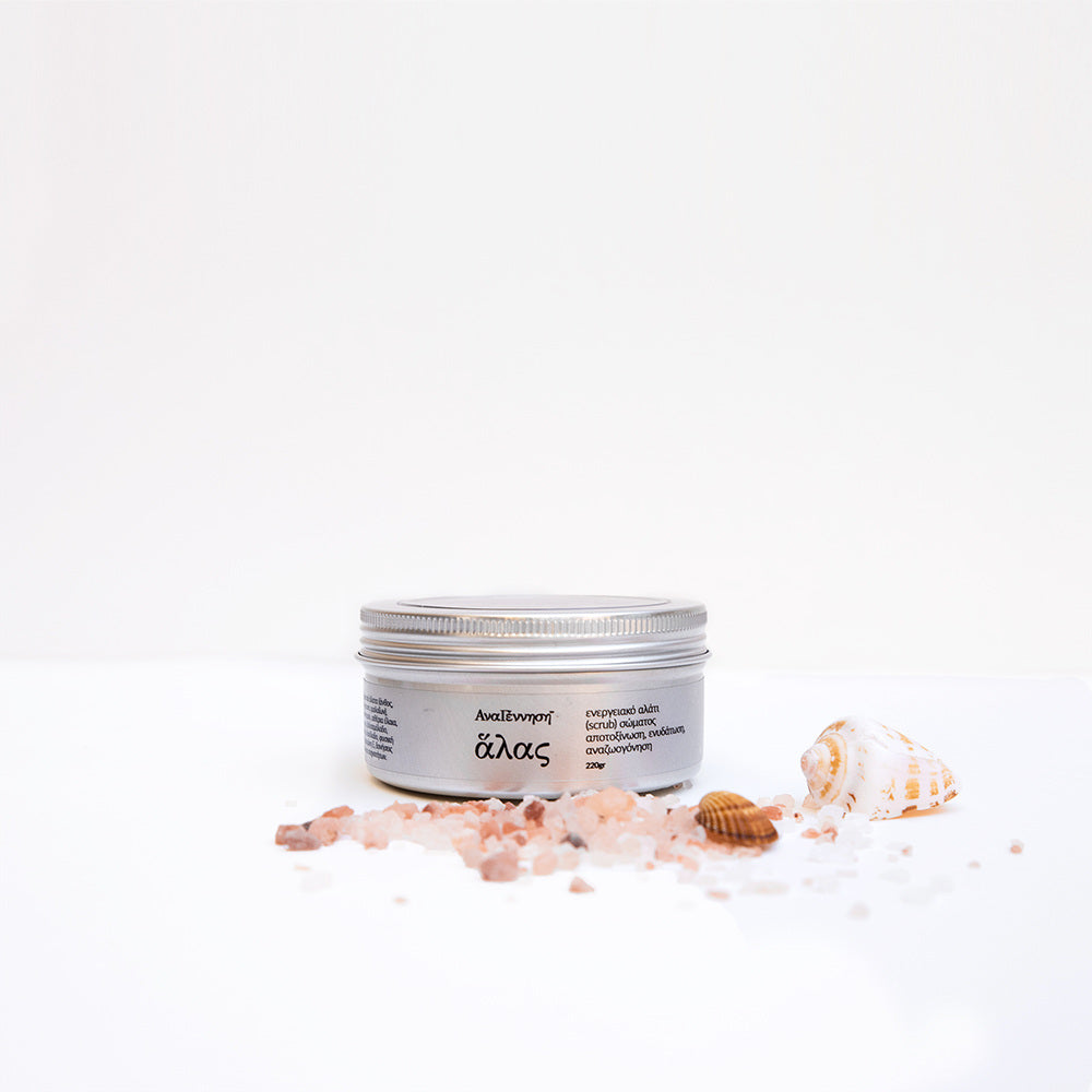 Natural energy salt scrub by ANAGENNISI with sea salt crystals and shells on white background