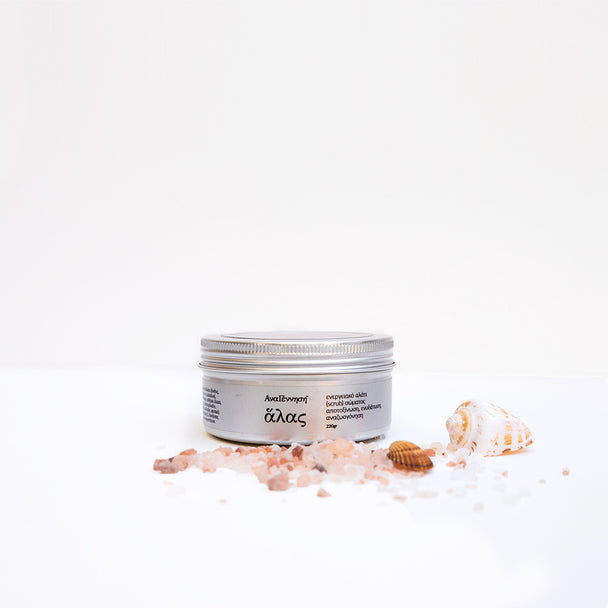 Natural energy salt scrub by ANAGENNISI with sea salt crystals and shells on white background