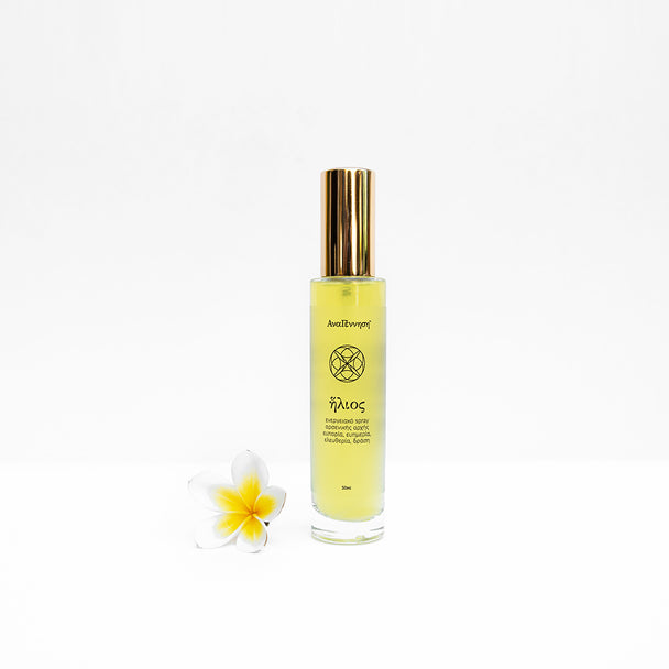 aura spray helios by ANAGENNISI, Yellow bottle with gold cap on a white background